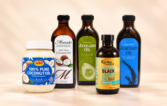 Five hair oils from CC Hair and Beauty arranged on a plain light background