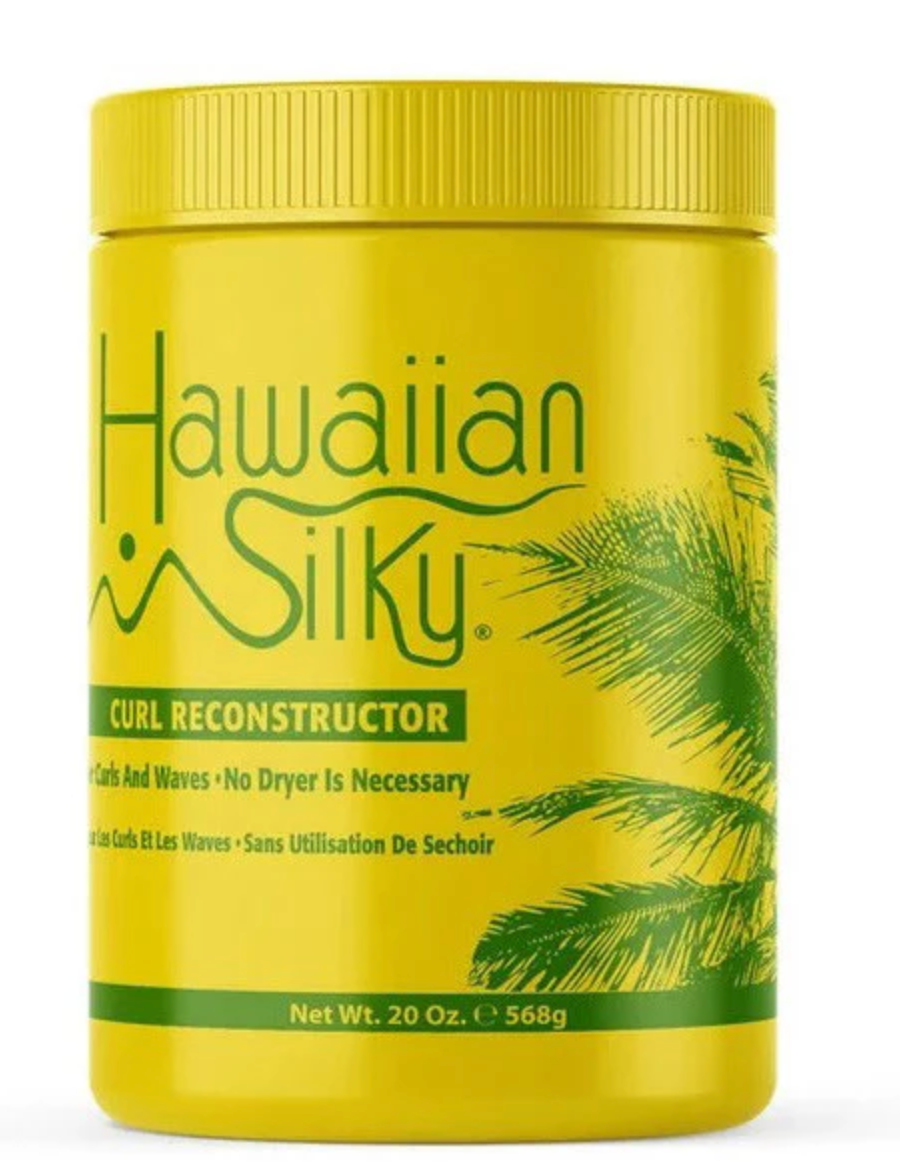 Woman applying Hawaiian Silky Curl Reconstructor to defined curly hair