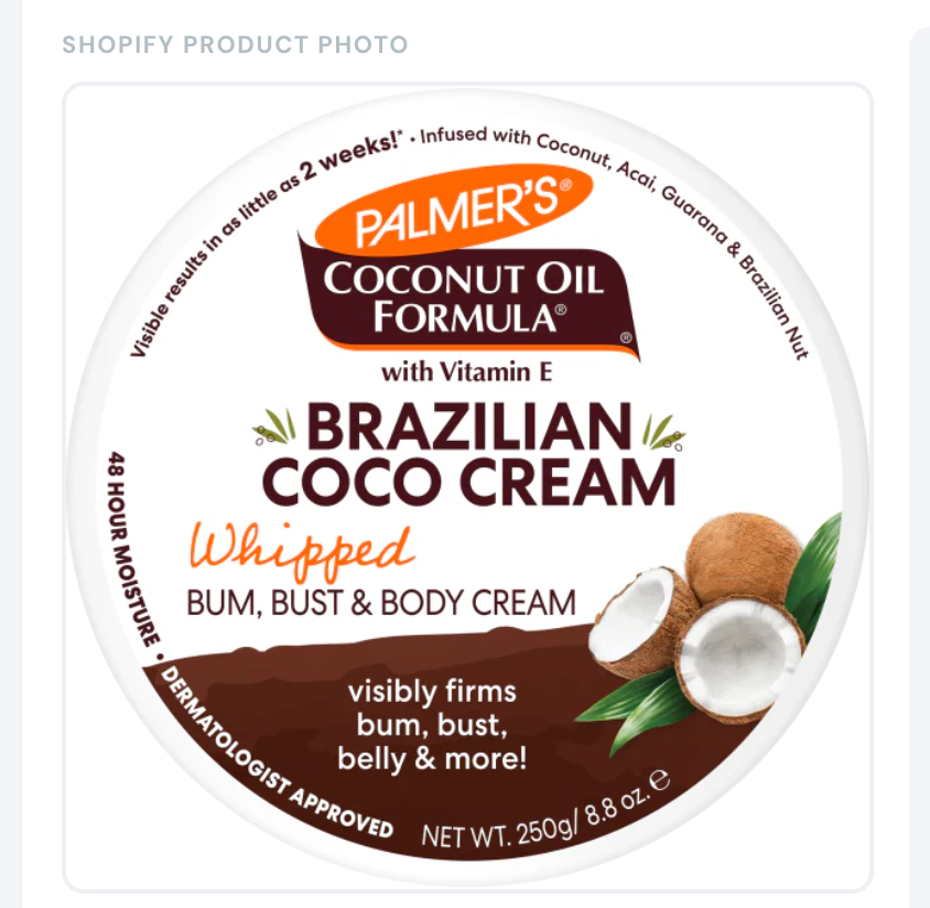 Palmer's Brazilian Coco Whipped Body Cream jar on bathroom counter with coconut and shea butter ingredients