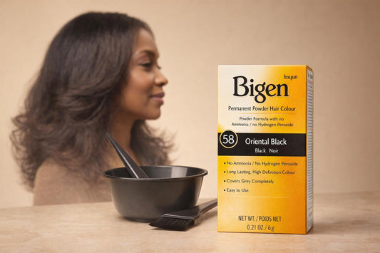 Bigen Permanent Powder Hair Colour box beside a mixing bowl and tint brush, with a woman with glossy dark natural hair