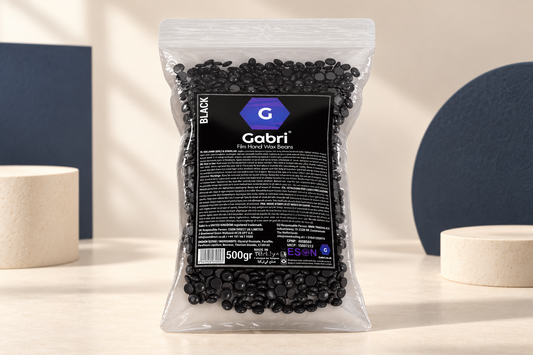 Gabri Professional Black Film Hand Wax Beans 500g in a clear pouch with black label in a cream studio