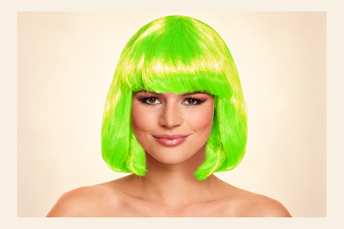 Green Bob Wig with fringe shown on a model against a cream background