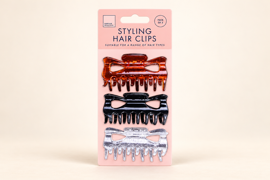 Forever Beautiful three-pack of brown, black and clear hair claw clips on a pink card