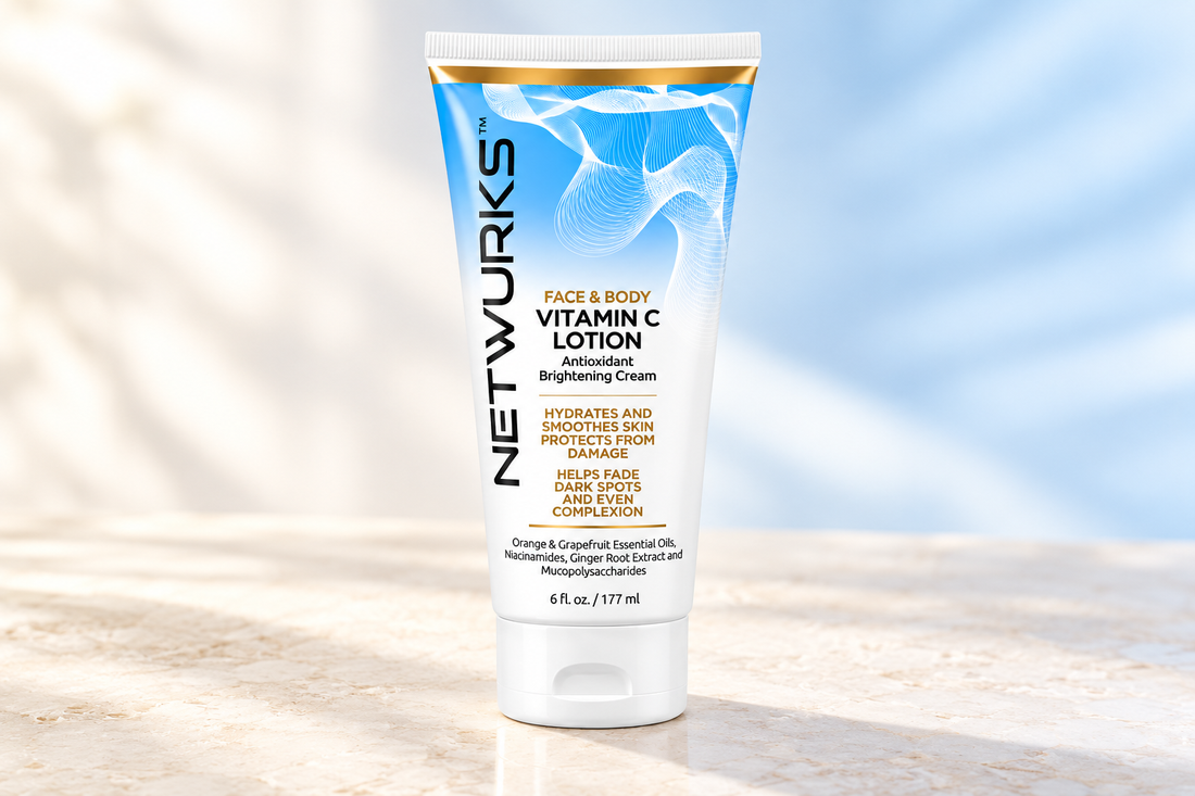 Netwurks Face and Body Vitamin C Lotion 177ml tube on a pale stone surface