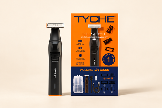 Tyche Dualfit black and orange face and body shaver beside its orange and navy 12-piece kit carton