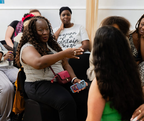 Attendee speaking into a microphone during the workshop.