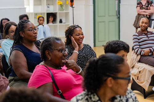 Workshop participants listening to an audience discussion.