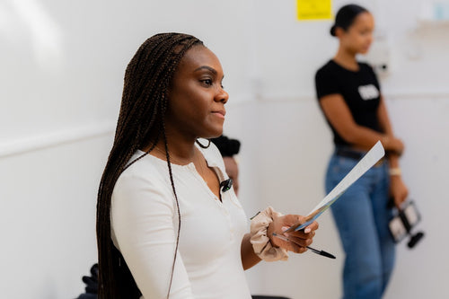 Close view of a workshop presenter speaking.