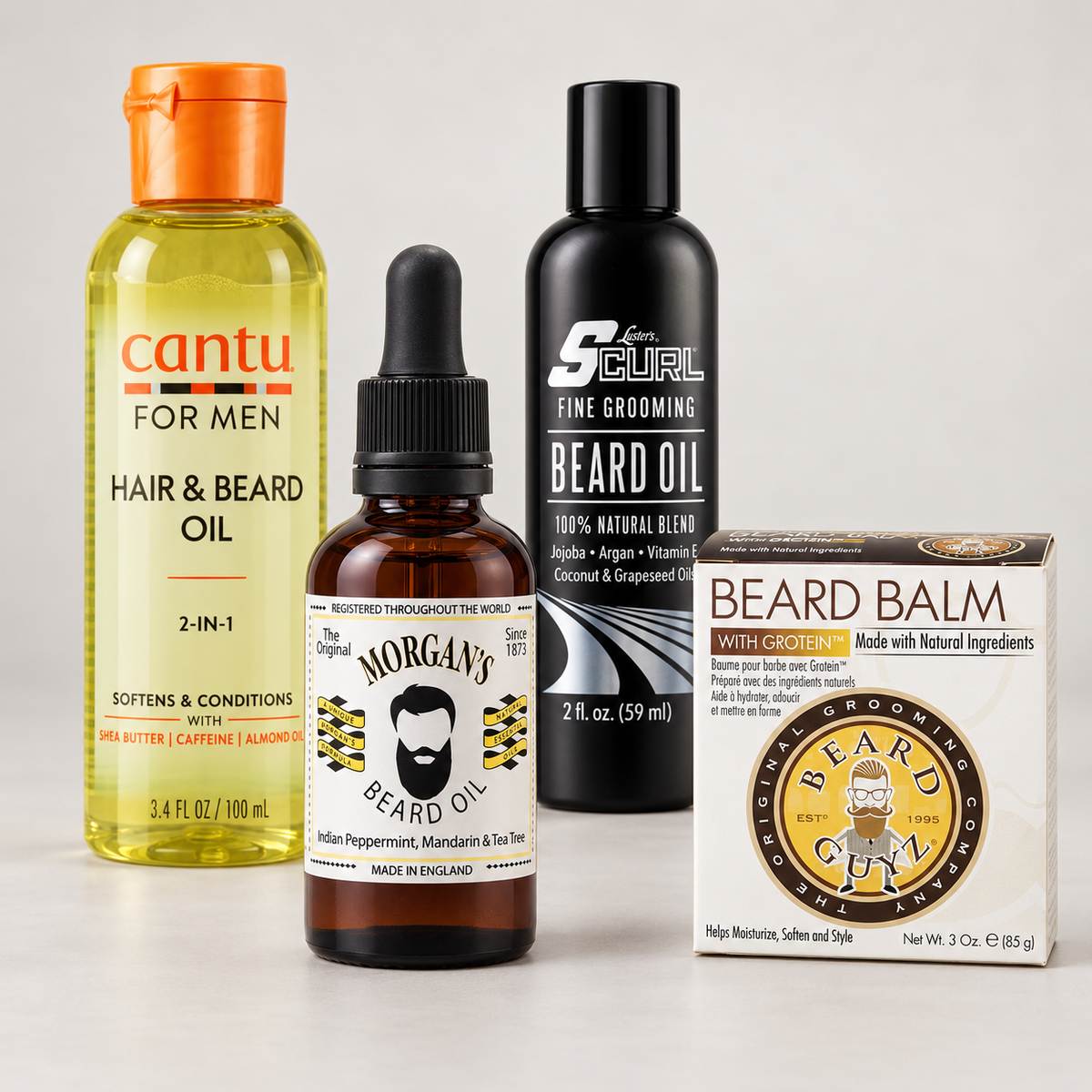 Cantu, Morgan’s and S-Curl beard oils with Beard Guyz beard balm on a light studio background.