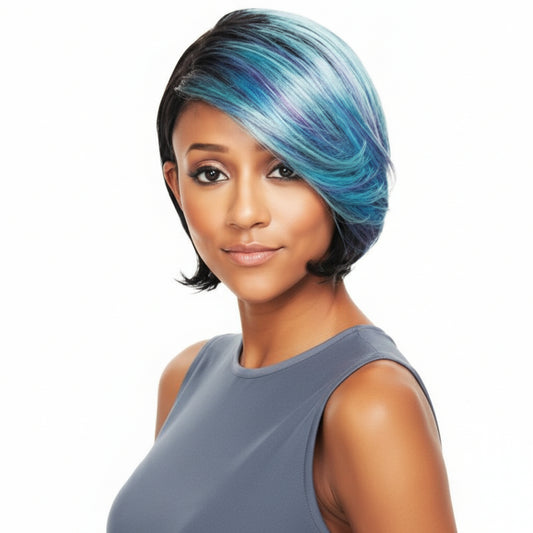A woman wearing a sleek synthetic hair wig with a pixie crop style featuring layers and cuts at the crown, with colors transitioning from dark at the roots to blue at the ends.